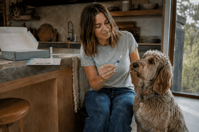 woman does pet dna test with her mixed breed dog